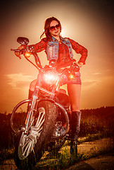 Image showing Biker girl and motorcycle