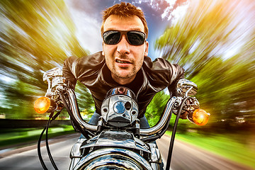 Image showing Biker on a motorcycle