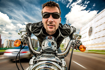 Image showing Funny Biker racing on the road