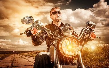 Image showing Biker on a motorcycle