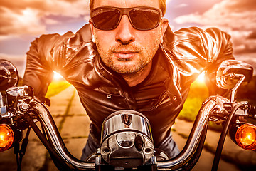 Image showing Biker on a motorcycle