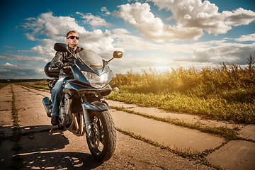 Image showing Biker on a motorcycle