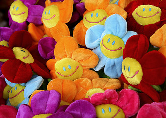 Image showing smiling colourful fabric flowers