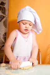 Image showing baby girl in cook role