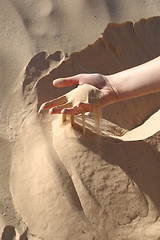 Image showing Hand in Sahara sand