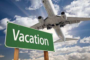 Image showing Vacation Green Road Sign and Airplane Above