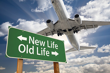 Image showing New Life, Old Life Green Road Sign and Airplane Above