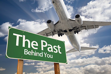 Image showing The Past Green Road Sign and Airplane Above