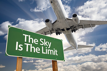 Image showing The Sky Is The Limit Green Road Sign and Airplane