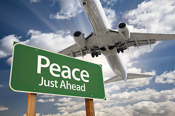 Image showing Peace Green Road Sign and Airplane Above