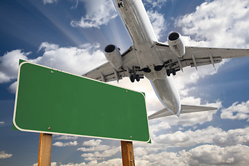 Image showing Blank Green Road Sign and Airplane Above