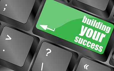 Image showing building your success words on button or key showing motivation for job or business