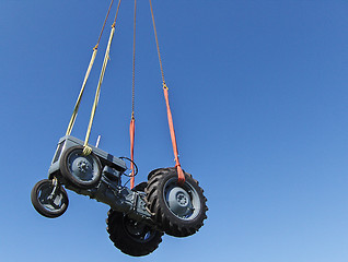 Image showing Vintage tractor hanging in the air Gråtass
