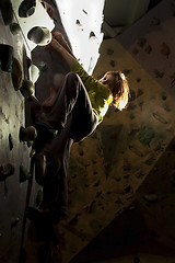 Image showing child rock climbing up the wall