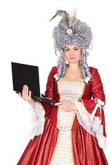 Image showing Woman in queen dress with laptop