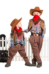 Image showing Two boys posing in cowboy costumes
