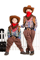 Image showing Two boys in cowboy costumes