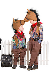 Image showing Two boys wearing horse costumes