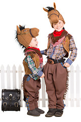 Image showing Two boys wearing horse costumes