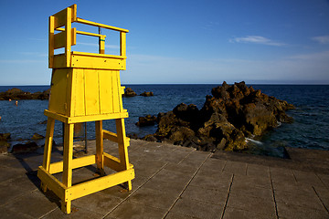 Image showing yellow lifeguard chair cabin  in spain  lanzarote  rock stone sk