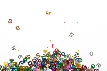 Image showing small color numbers confetti on white