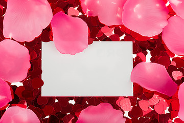 Image showing small red confetti and big hearts on white background