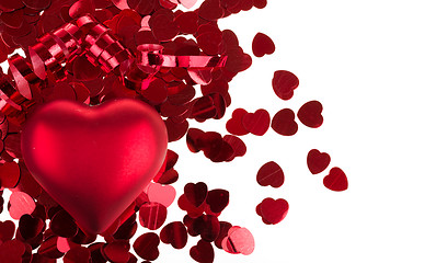 Image showing small red confetti and big hearts on white background