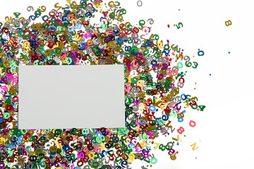 Image showing small color numbers confetti on white