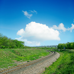 Image showing railroad in green landscape and clouds over it