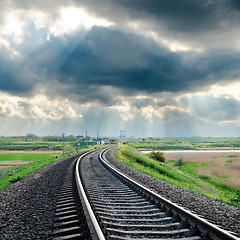 Image showing railroad and rainy clouds over it