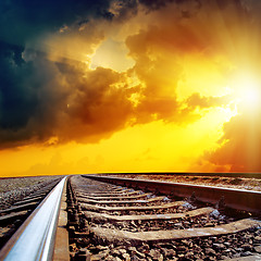 Image showing cloudy sunset over railroad