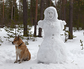 Image showing Sculpture of a woman made of snow in the forest park 