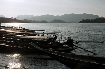 Image showing Long tail boats on a lake . Chiew Lan Lake (Rajjaphapa Dam), Tha