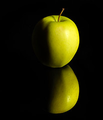 Image showing apple on reflective ground