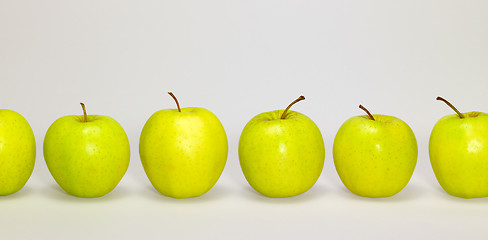 Image showing apples in a row