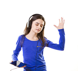 Image showing Smiling girl listening to music