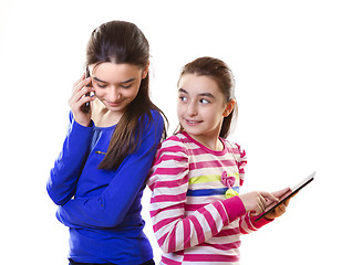 Image showing Happy teen girls with digital tablet and smartphone 