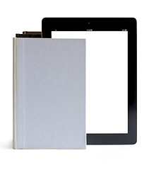 Image showing Tablet pc into the books