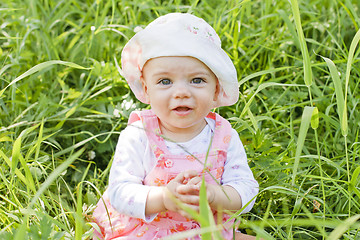 Image showing Happy baby girl with blue eyes 