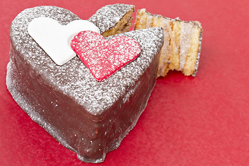 Image showing Heart shaped slice of a chocolate-cake