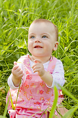 Image showing Happy baby girl on grass