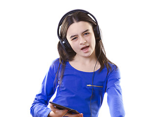 Image showing Smiling girl listening to music