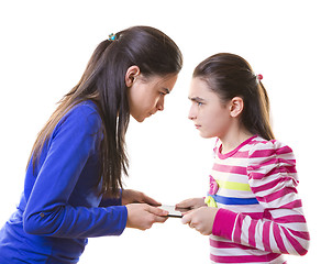 Image showing Teen girls fighting for digital tablet 