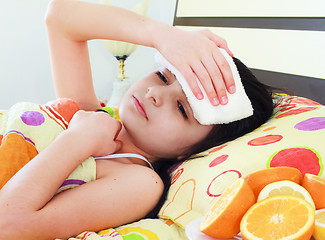 Image showing Sick young girl in bed