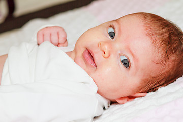 Image showing Smiling newborn baby girl