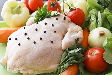 Image showing Whole raw chicken with vegetables and pepper