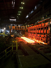 Image showing Hot steel on conveyor