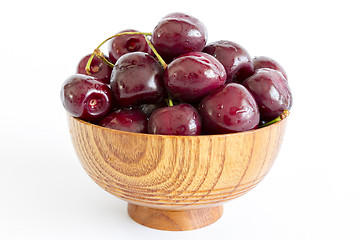 Image showing Fresh Cherries in a wooden bowl