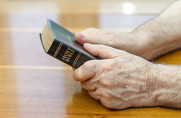 Image showing Holding the bible