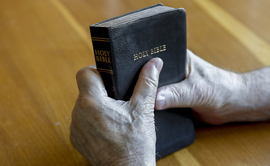Image showing holding the bible